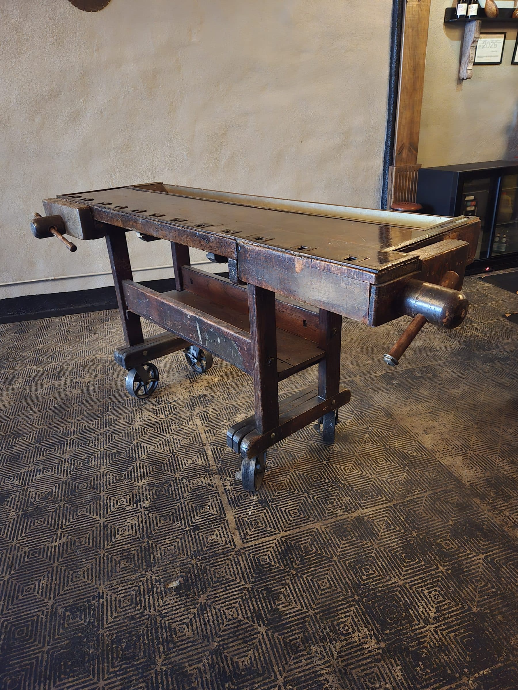 Custom-built industrial estate table on casters