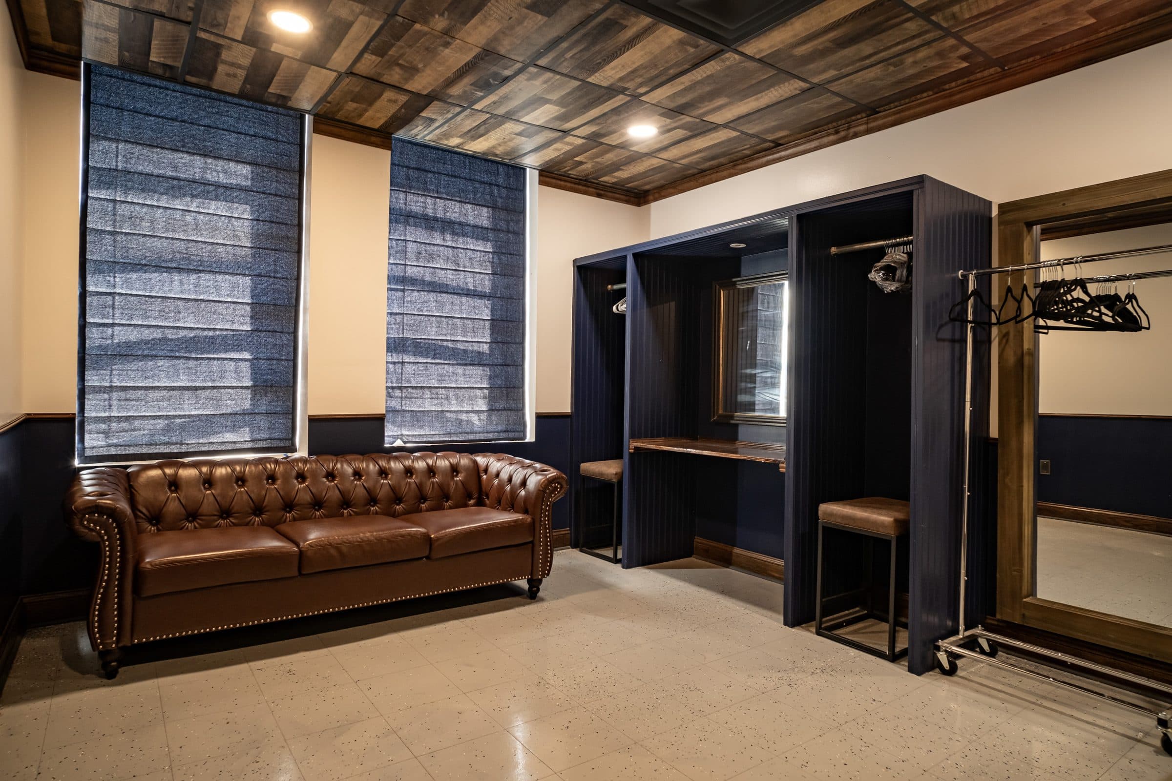 The Pryor Room getting-ready suite with a leather sofa and wardrobe space